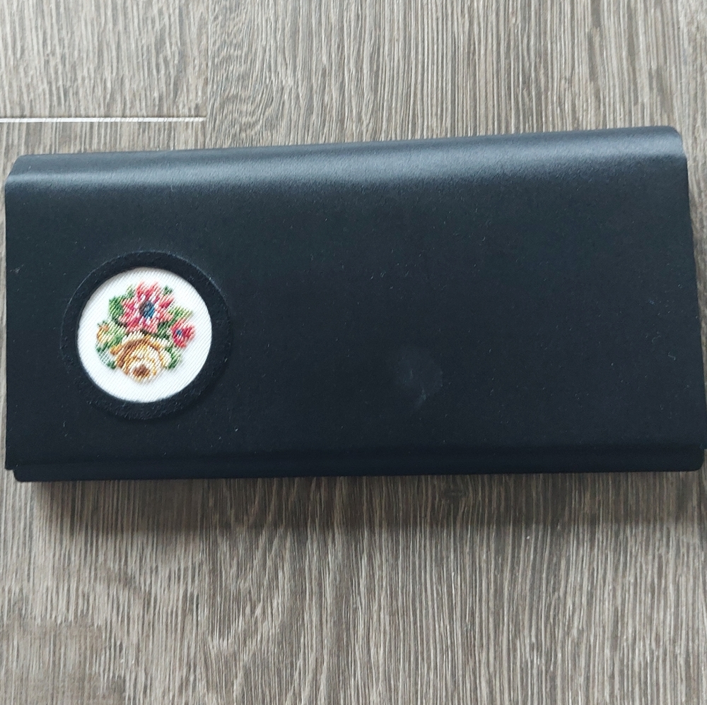 Petit point from Vienna black silk satin clutch with floral petit point.